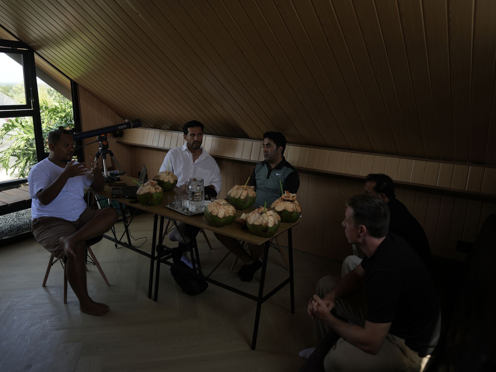 Architect (left) presenting to Juan and Akhtar, founders of South Developments, at a working session on the slope above Tampah Bay